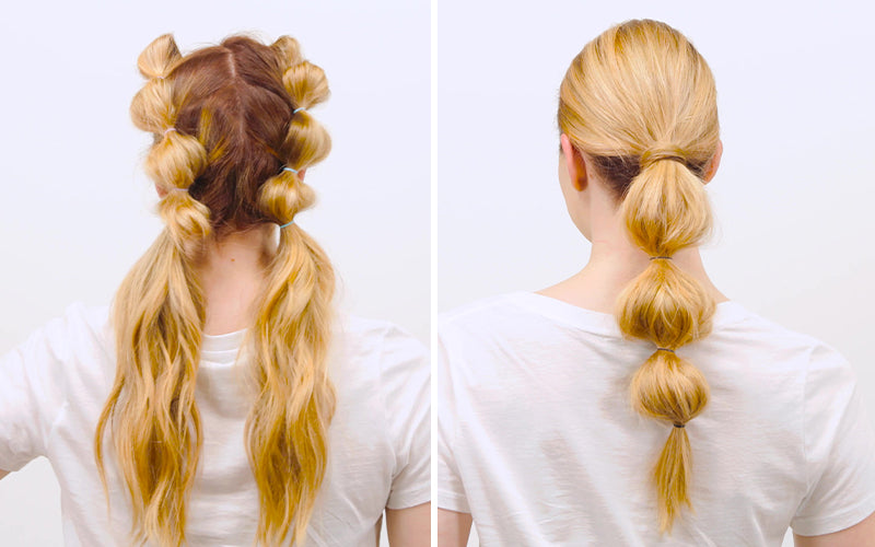 A woman photographed from behind wearing a sleek blonde bubble ponytail with evenly spaced rounded sections creating a segmented, voluminous effect, against a white background. Featured image for blog post: Summer Hairstyles to Take Back to School