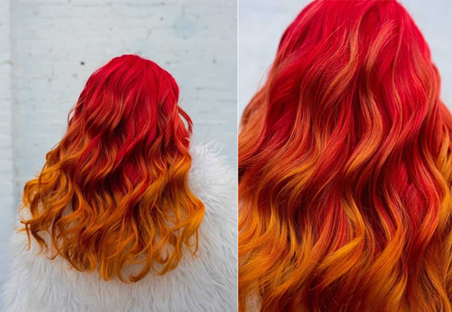 Rear view of a woman's long wavy hair in a vivid fire gradient — deep red at the roots blending to bright orange and golden yellow at the ends. Featured image for blog post: Get Those Creative Color Juices Flowing with the Pros!