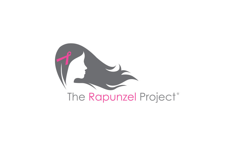 The Rapunzel Project logo featuring a grey silhouette of a woman profile with long flowing hair and a pink cancer awareness ribbon