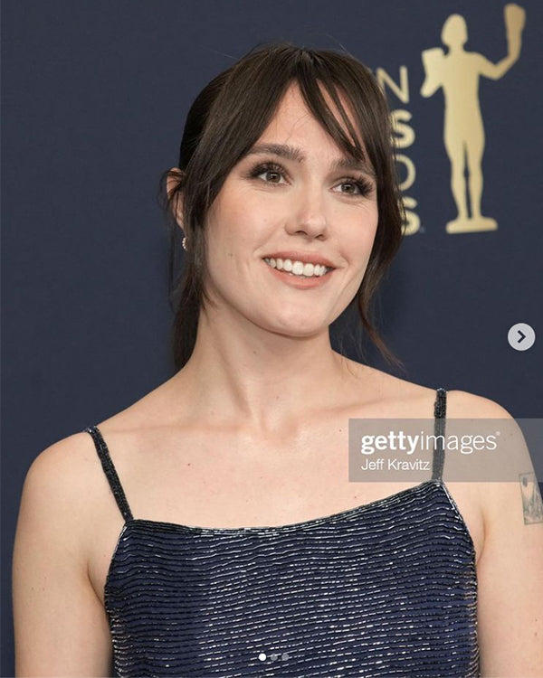 A woman with dark shoulder-length hair wearing a black spaghetti-strap dress photographed at the SAG Awards red carpet event. Featured image for blog post: Kenra Professional at the Screen Actors Guild Awards!